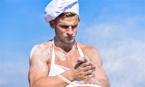 Cook Or Chef With Muscular Shoulders And Chest Covered With Flour Baker Concept Stock Image