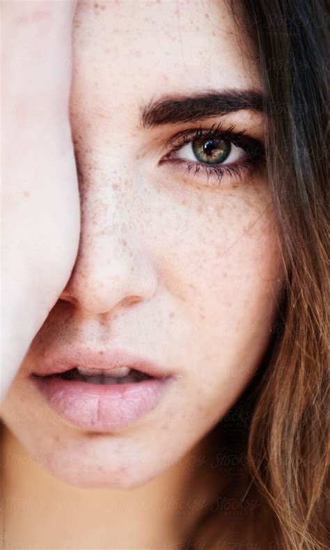confident woman covering half of face by stocksy contributor guille faingold stocksy