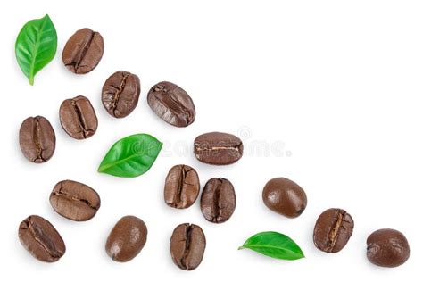 Heap Of Roasted Coffee Beans With Leaves Isolated On White Background