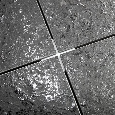 Tile spacers hold the tiles at a consistent distance until the mortar sets, and then grout fills in the gaps. Extra Long Legged Tile Spacers - Tileasy