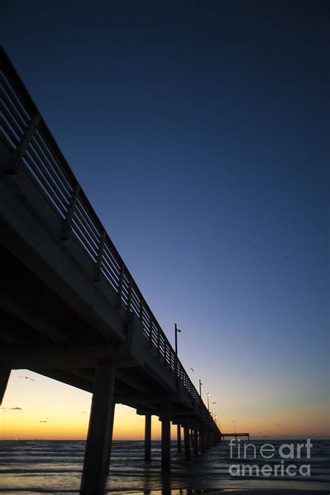 Book a charter, cast a line from the pier, or enter a tournament for the ultimate fishing known to casual and serious anglers alike as the fishing capital of texas, port aransas offers challenges and a string of rewards for everyone. Port Aransas Fishing Pier Photograph by Andre Babiak