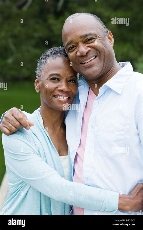 Smiling African American Couple Hugging Stock Photo Alamy