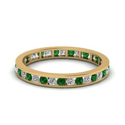 They add that extra sparkle and stand out on any finger. Channel Set Diamond Eternity Wedding Band With Emerald In ...