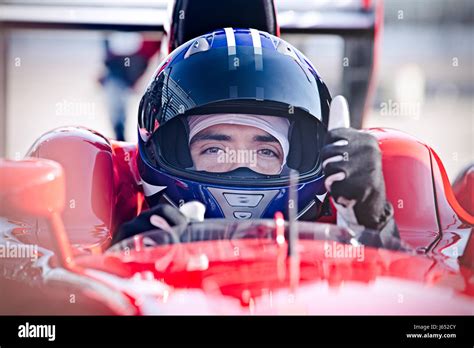 Portrait Confident Male Formula One Race Car Driver Gesturing Thumbs Up