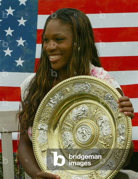 Image Of Serena Williams Holds The Winners Trophy After Victory The