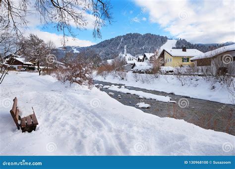 Walkway Along Loisach River Garmisch With Bench And View To Ski Stock
