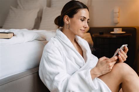 Smiling Middle Aged Brunette White Woman Stock Photo Image Of Bathrobe Call