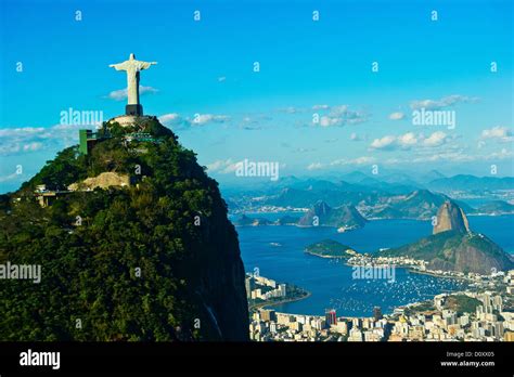 Christ The Redeemer Statue Overlooking Rio De Janeiro And Sugarloaf