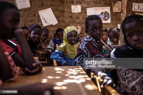Pupils Attend A Lesson In A Classroom At The Sakoira School In The