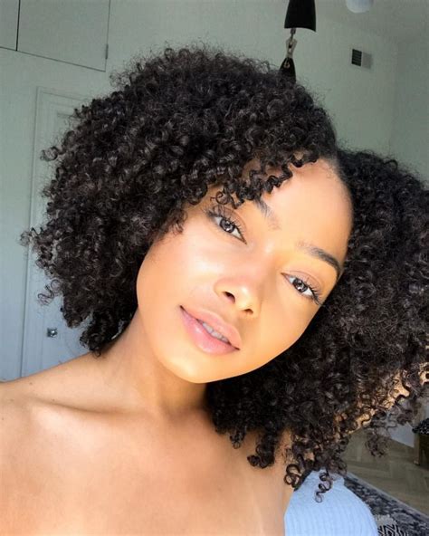 12 natural hair influencers to follow according to hair type