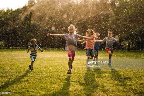 Children Enjoying Running In The Nature High-Res Stock Photo - Getty Images