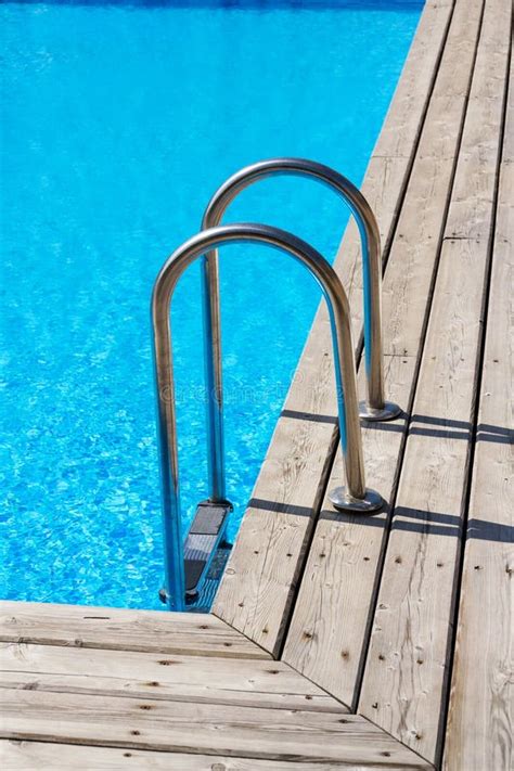 Steel Ladder Stairs Into Blue Outdoor Skimmer Pool Wooden Floor Stock