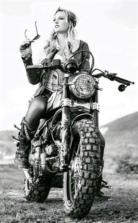 A Woman Sitting On Top Of A Motorcycle
