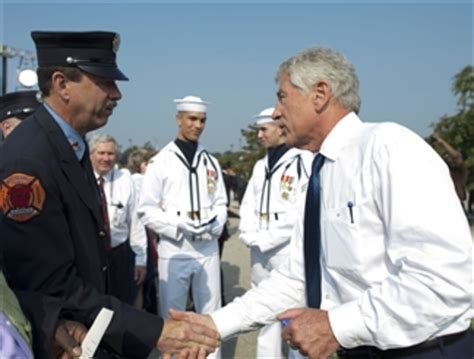 Secretary Hagel Greets A Firefighter After A Remembrance Ceremony To