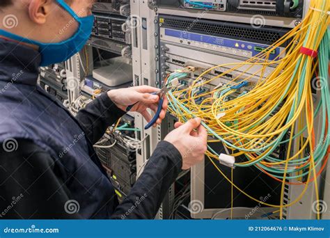 The Specialist Removes Unnecessary Wires In The Data Center Cutting