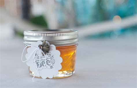 Diy glass milk bottle centerpieces. DIY Honey Mason Jar Wedding Favors