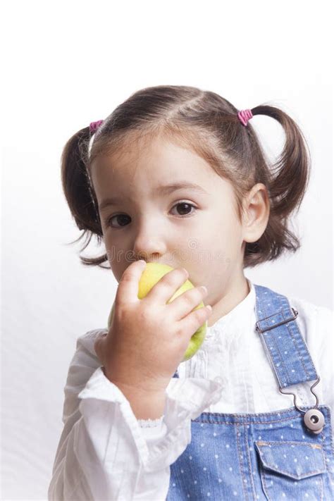 193 Little Girl Biting Green Apple Stock Photos Free And Royalty Free