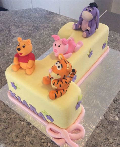 The children's cakes are always my favourite, they are bright, colourful and. Winnie the Pooh and friends first birthday cake | Baby ...