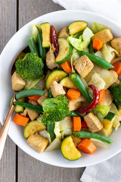 Toss the ingredients from the centre to the side of the wok using a wooden spatula. Stir Fry Tofu | Hot Pot Grill
