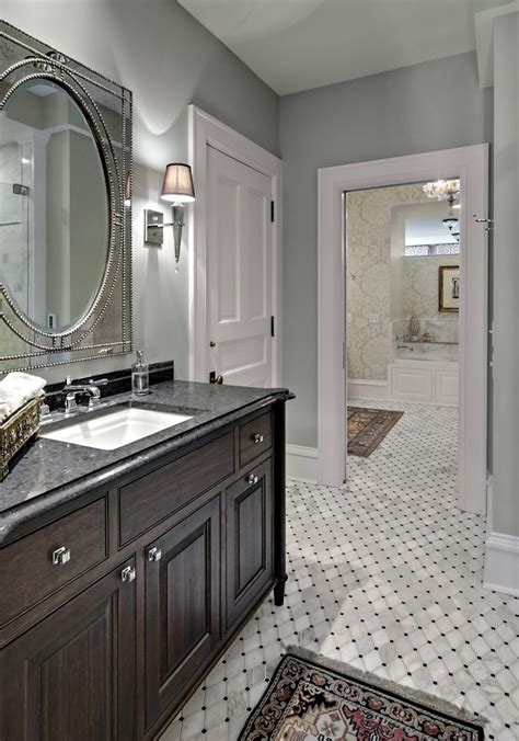 It's the place to which you escape to prepare for the day and unwind when it's done. minneapolis white bathroom floor tiles traditional with ...