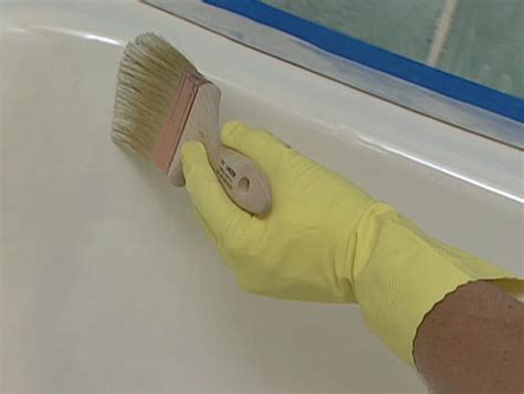 An expert starts by sanding down the tub's. How to Refinish a Bathtub | How To Build It