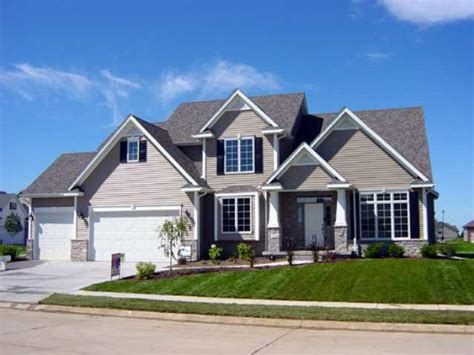 Behind this davenport mansion's gray exterior is an updated home with oak floors, french doors and a private wine cellar. 593 Clover Hill Lane, LeClaire, Iowa 52753