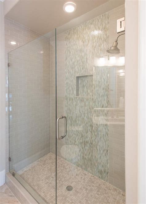 Larger subway tiles will lend a more contemporary vibe to a bathroom, while still retaining a sense of timelessness. Bathroom: Neutral Subway Tile Shower With Frameless Glass ...