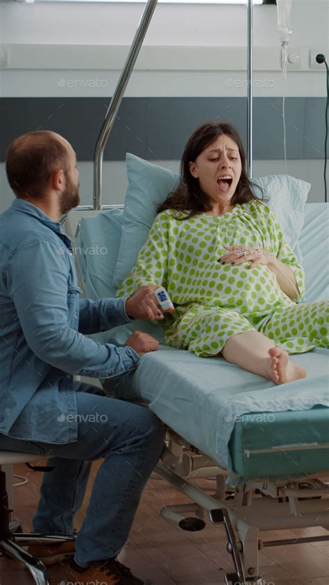 Screaming Pregnant Woman Going Into Labor In Hospital Ward Stock Photo By DC Studio