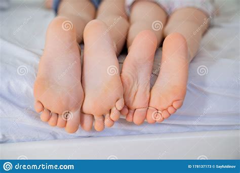 Little Legs On Bed Pink Feet And Smooth Heels Stock Image Image Of