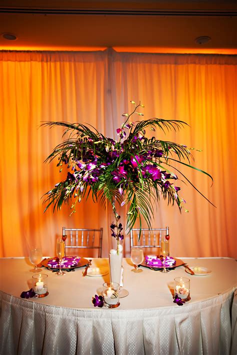 Tropical Purple And Palm Tree Leaf Centerpiece Palm Trees Wedding
