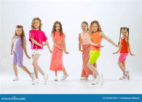 Portrait Of Happy Active Little Girls Happy Kids In Bright Colorful