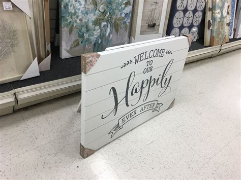 A Sign That Is On The Ground In A Store
