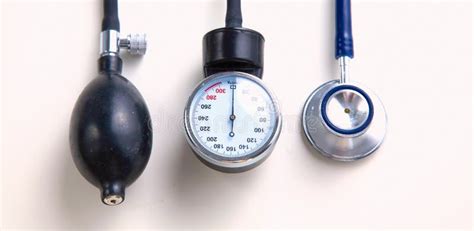 A Stethoscope And Blood Pressure Gauge On A White Background Stock