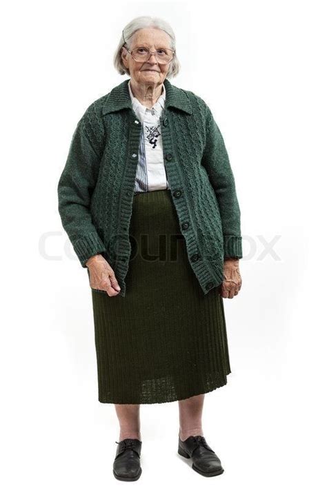 an old woman in a green jacket and skirt
