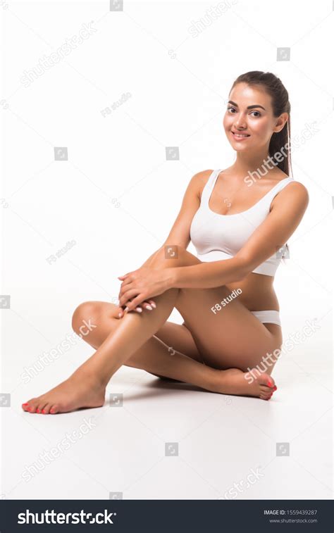 Beautiful Barefoot Woman Sitting On Floor Foto De Stock
