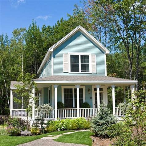 Blue Cottage With Great Porch Light Blue Houses Curb Appeal House