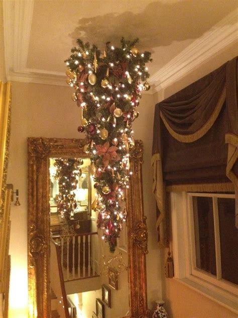 Branch hung from the ceiling to hold stockings. Pin by ~ gardenfairy ~ on GOTTA LUV CHRISTMAS! | Pinterest