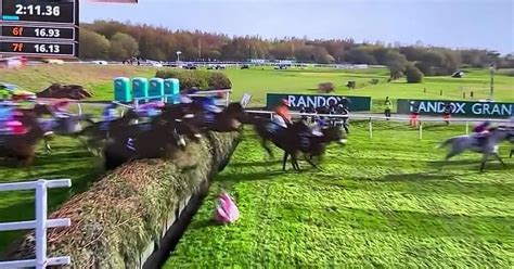 Loose Horse Causes Grand National Chaos As Jockey Sent Flying Over