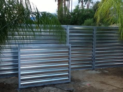 Corrugated metal fencing is a sustainable choice. Corrugated metal fence (Palm Springs Style)