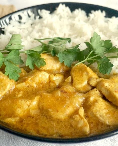 Close Up Shot Of A Plate Of Chicken Korma And Rice Chicken Korma