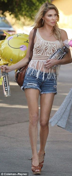 Brandi Glanville Goes Braless In Lace Top And Tiny Shorts While Picking