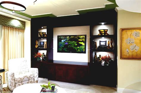 A corner showcase design will fit into the finickiest parts of your room with ease, transforming dead space into a design element. 10 Latest TV Showcase Designs With Pictures In 2020