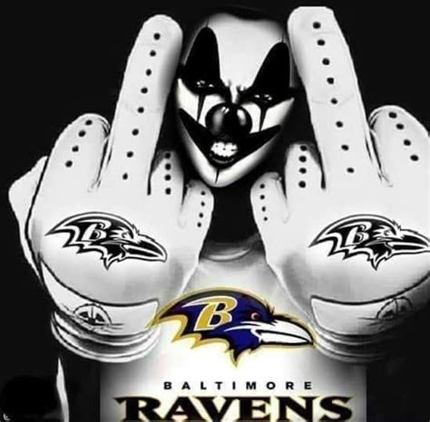 The Baltimore Ravens Mascot Is Holding His Hands Up To Their Face While