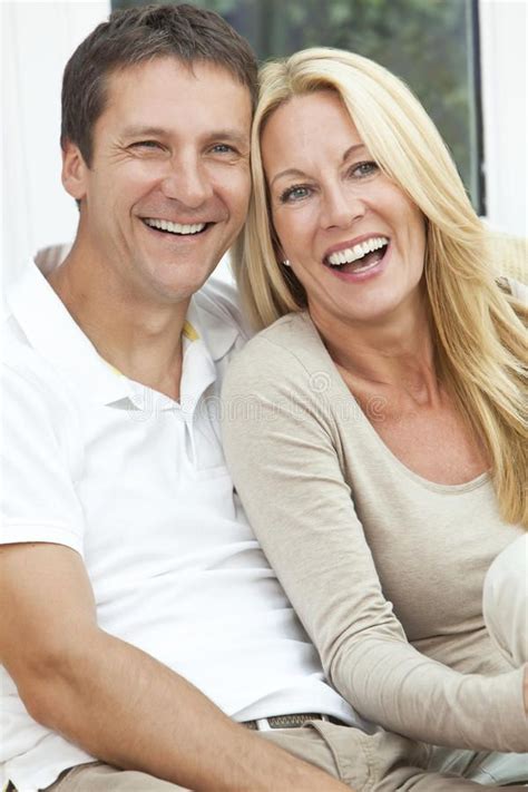 happy middle aged man and woman couple laughing portrait shot of an attractive… middle aged