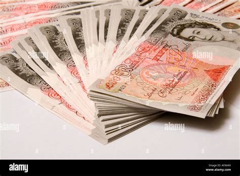 A Pile Of New Fifty Pound Notes Totaling Five Thousand Pounds Stock