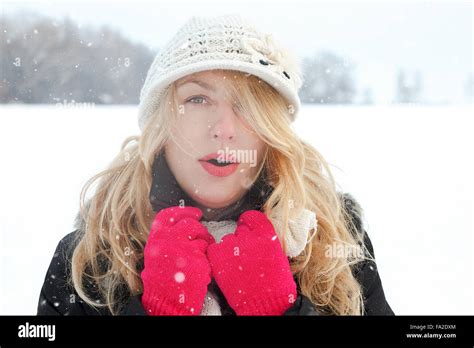 Winter Woman In Snow Photo Looking And Blows Breath At Camera Outside