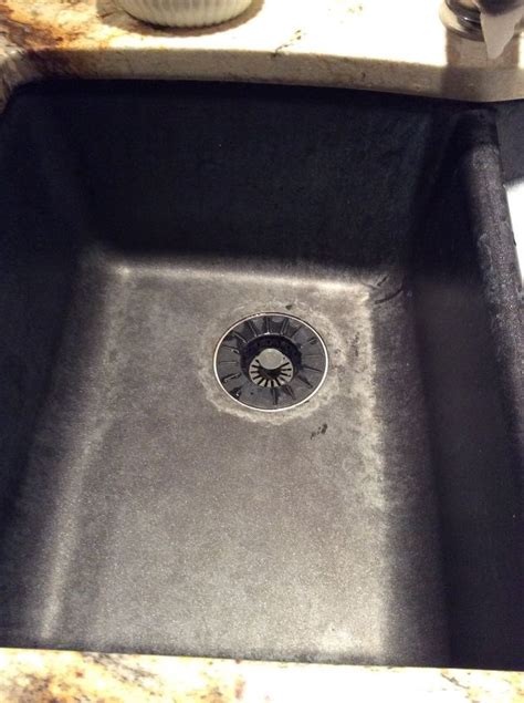 Scrub your sink in circular motions using a nylon brush and gentle soap such as dishwashing soap. Hard water stains in granite sink | Hometalk