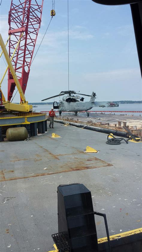 Crofton Uses Barge Mounted Crane To Recover Navy Mh 60 Helicopter From