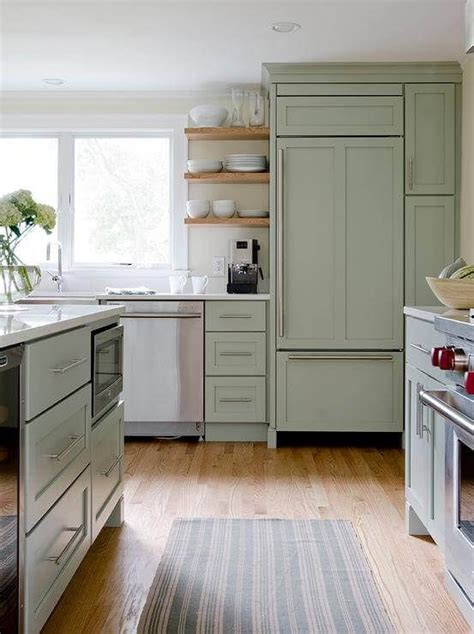 The combination of sage green cabinets and tile creates a timeless kitchen backsplash. 28 Sage Green Decor Ideas | Green kitchen island, Kitchen ...