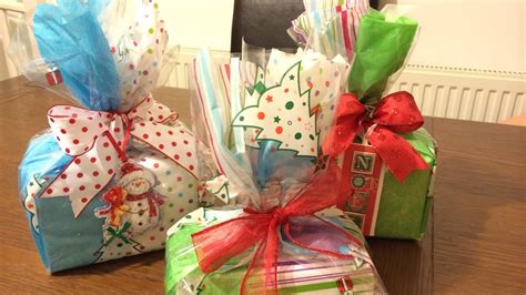 Then add your ribbon or gift tag. (Box and cubes) Ultimate How to: Perfect gift wrapping ...